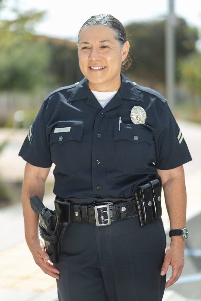 Policewoman in Uniform Standing on the Street