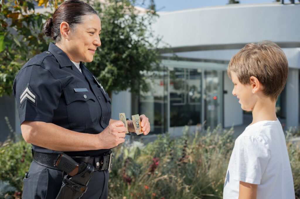 A Police woman Talking to a Boy